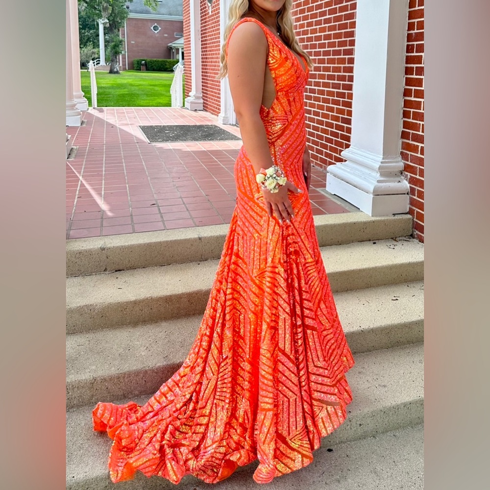 Jovani dress in orange-size 4- straps taken in a bit and added a bustle